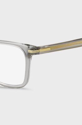 Clear-acetate optical frames with signature gold-tone detail, Transparent