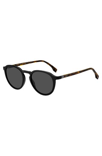 Schwarze Sonnenbrille mit Havanna-Muster an den Bügeln und 360-Grad-Scharnieren, Gemustert