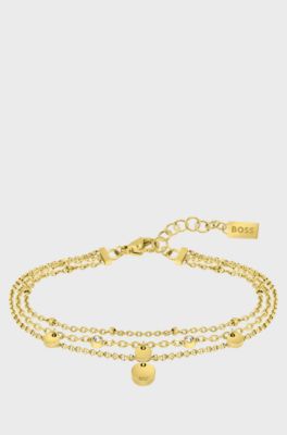 Multi-strand bracelet with medallions and crystals, Gold tone
