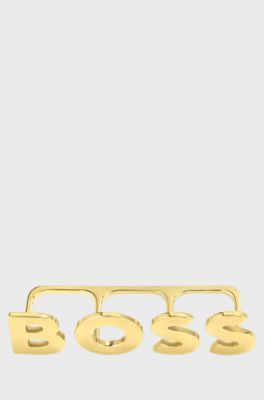 Light-golden-plated knuckle ring with logo letters, Gold tone
