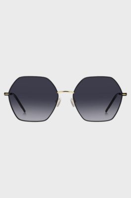 Angular sunglasses in black and gold-tone steel, Gold