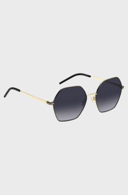 Angular sunglasses in black and gold-tone steel, Gold