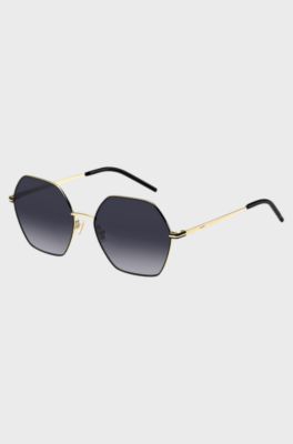 Angular sunglasses in black and gold-tone steel, Gold