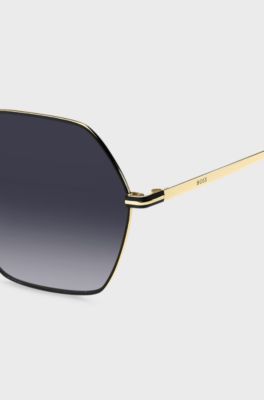 Angular sunglasses in black and gold-tone steel, Gold