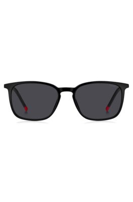 Black sunglasses with signature-red details, Black