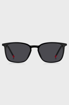 Black sunglasses with signature-red details, Black