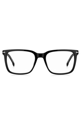 Monture optique en acétate noir avec garnitures argentées emblématiques