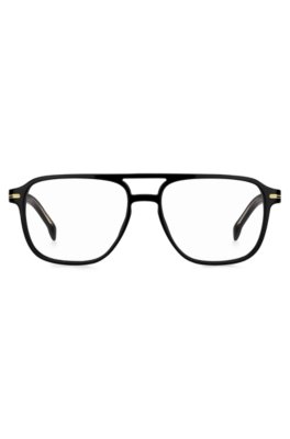 Monture optique en acétate noir avec garnitures en métal doré emblématiques