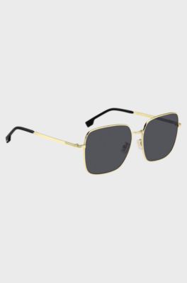 Gold-tone sunglasses with signature hardware, Gold