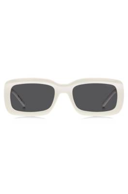 White sunglasses with stacked-logo temples