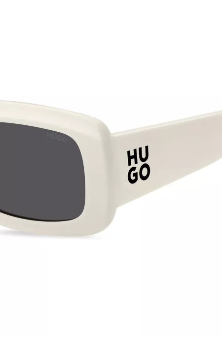 White sunglasses with stacked-logo temples