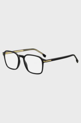 Black-acetate optical frames with gold-tone details, Black