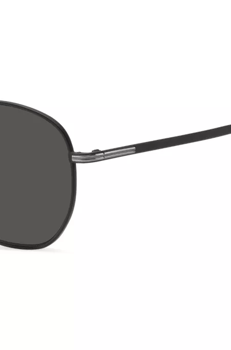 Round sunglasses in black metal with silver-tone hardware