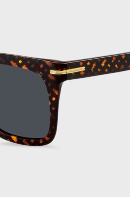Occhiali da sole con monogrammi e dettagli in metallo dorato, A disegni