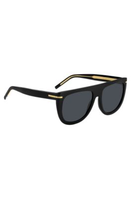 Sonnenbrille aus schwarzem Acetat mit goldfarbenen Metalldetails, Schwarz