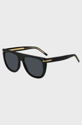 Sonnenbrille aus schwarzem Acetat mit goldfarbenen Metalldetails, Schwarz