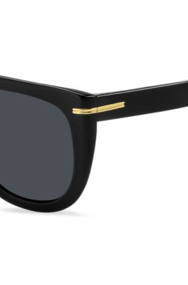 Sonnenbrille aus schwarzem Acetat mit goldfarbenen Metalldetails, Schwarz