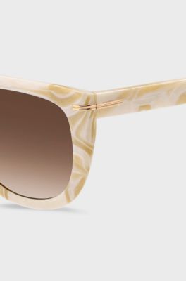 Gemusterte Sonnenbrille aus Acetat mit goldfarbenen Metalldetails, Gemustert