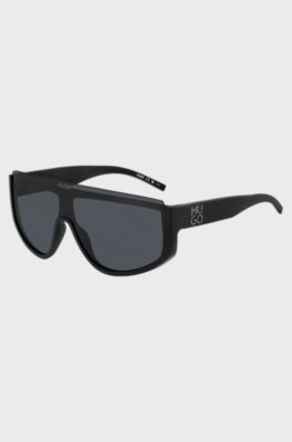 Schwarze Sonnenbrille im Masken-Stil mit Stack-Logo, Schwarz