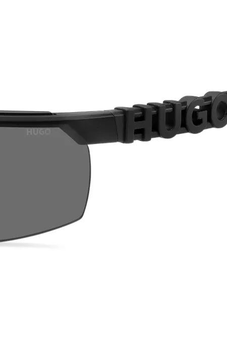 Mask-style sunglasses in black with 3D-logo temples