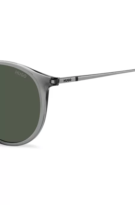 Grey sunglasses with rounded metal temples