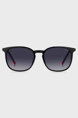 Schwarze Sonnenbrille mit goldfarbenen B&uuml;geln, Schwarz