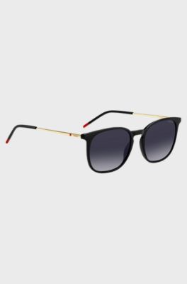 Schwarze Sonnenbrille mit goldfarbenen B&uuml;geln, Schwarz