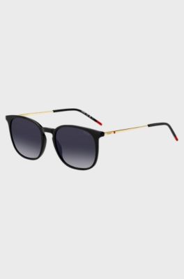 Schwarze Sonnenbrille mit goldfarbenen B&uuml;geln, Schwarz