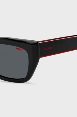 Black-acetate sunglasses with signature-red layered temples, Black