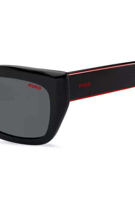 Black-acetate sunglasses with signature-red layered temples