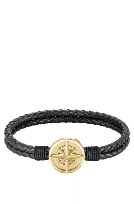 Braided black leather cuff with golden-tone compass plate