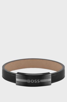 Leather cuff with metal enamel-filled-logo plate, Black