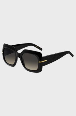Sonnenbrille aus schwarzem Acetat mit Monogramm-B&uuml;geln, Schwarz