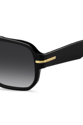 Black-acetate sunglasses with gold-tone details , Black