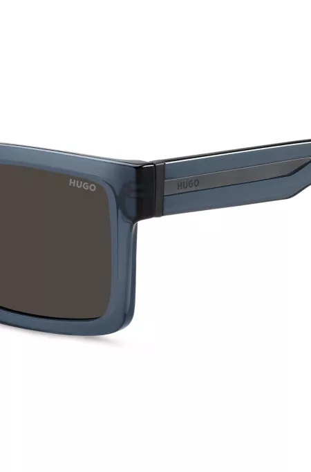 Transparent-blue sunglasses with grey lenses