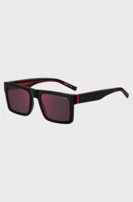 Black sunglasses with signature red accents, Black