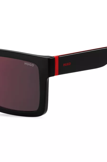 Black sunglasses with signature red accents