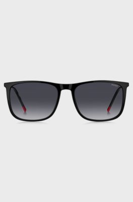 Black sunglasses with signature-red details, Black