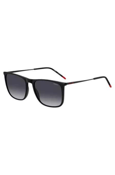 Black sunglasses with signature-red details