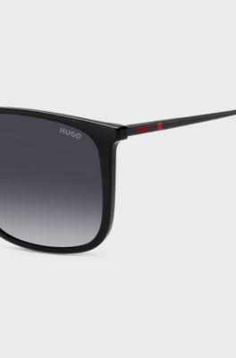 Black sunglasses with signature-red details, Black