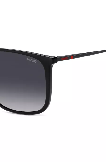 Black sunglasses with signature-red details