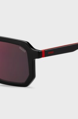 Black sunglasses with signature red accents, Black