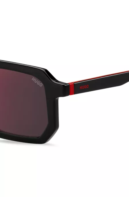 Black sunglasses with signature red accents