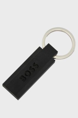 Schl&uuml;sselanh&auml;nger aus schwarzem Silikon und Messing mit Logo, Schwarz