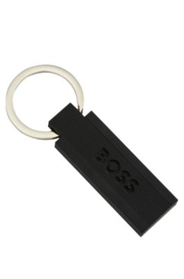 Logo key ring in black silicone and brass, Black