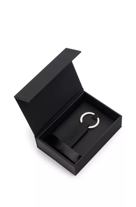 Logo key ring in black silicone and brass