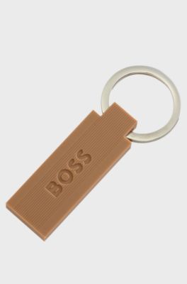 Portachiavi con logo in ottone e silicone color cammello, Marrone