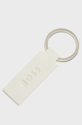 Logo key ring in silicone and brass, White