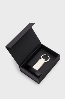 Logo key ring in silicone and brass, White