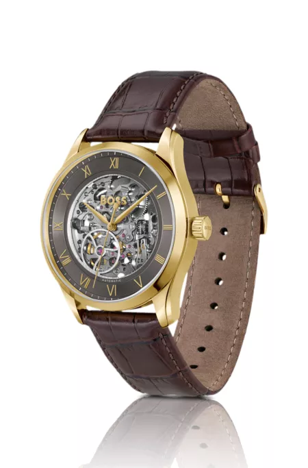 Gold-tone automatic watch with skeleton dial